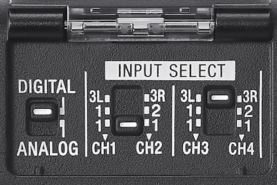 Obrázek produktu zobrazující detail panelu přepínačů výběru vstupu na adaptéru XLR XLR-A4.
